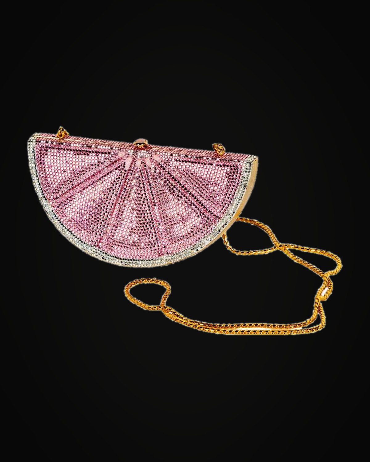 From the Parkes wardrobe: a Chanel houndstooth tweed jacket, a Judith Leiber pink lemon-slice minaudière and a quilted Chanel duffle, on black